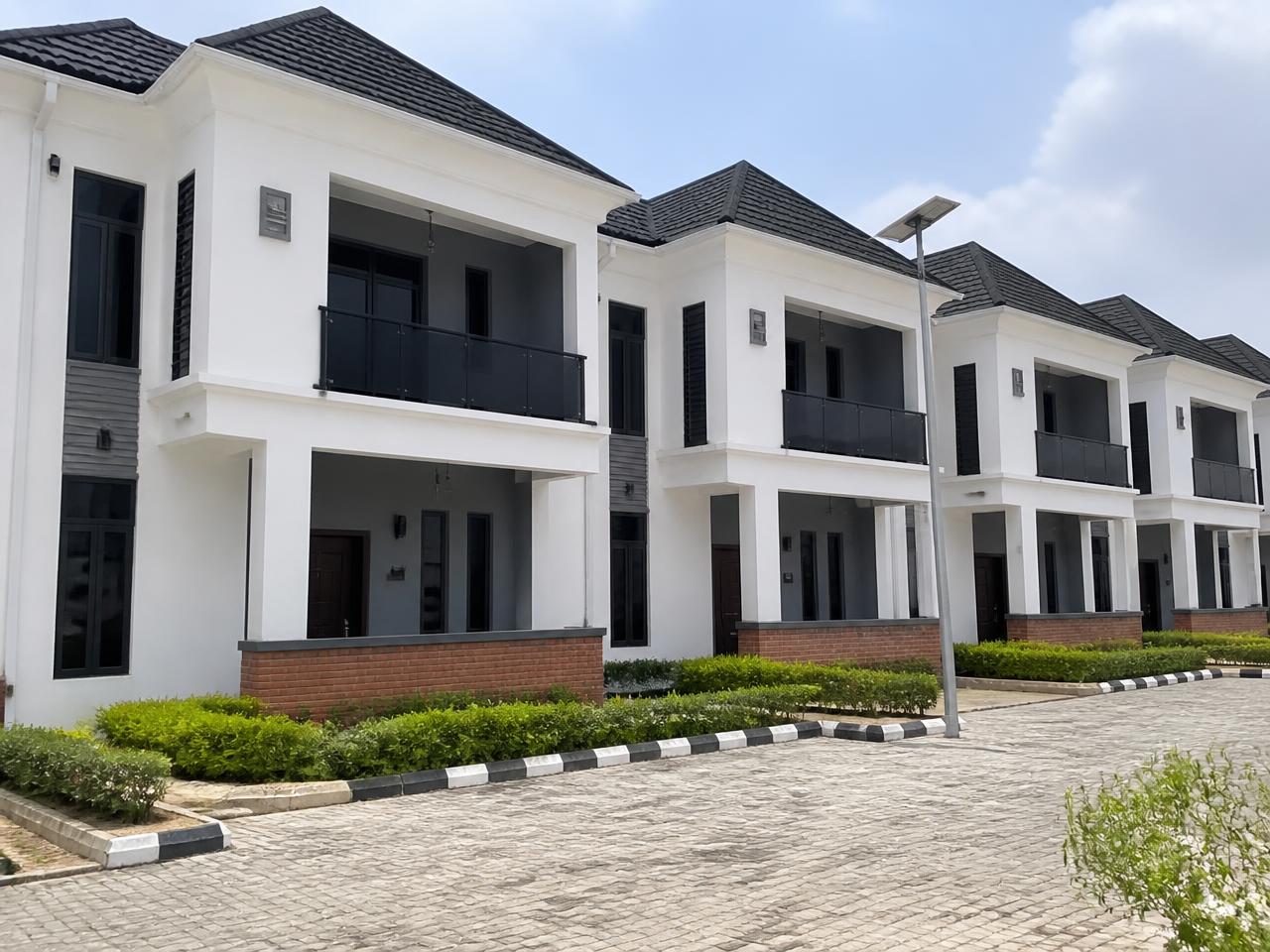 Terraced family homes with landscaped frontage